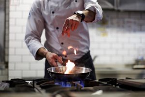 chef in the kitchen of a restaurant, cooking