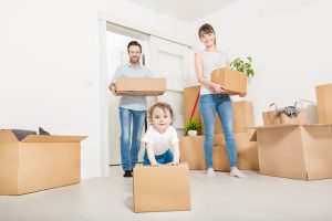 Young family with a child moves to a new home