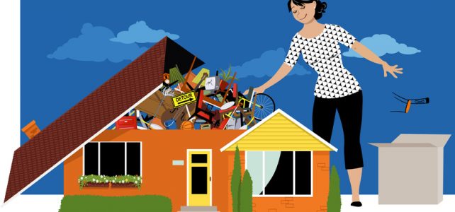 Woman decluttering, throwing away things from a house