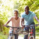 active adult couple biking