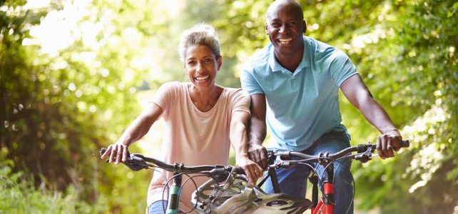 active adult couple biking